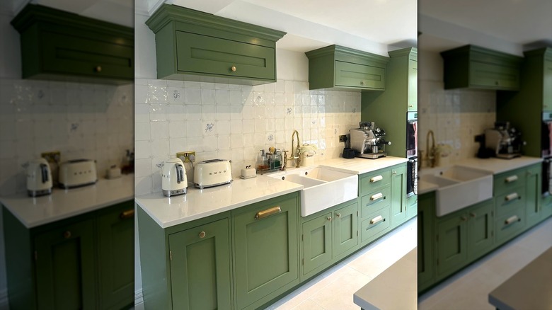 Modern kitchen with green cabinets, white countertop and delf tile backsplash