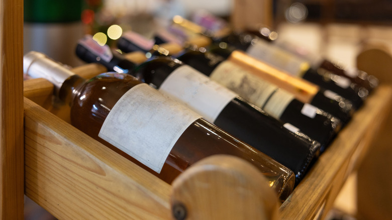 A wooden accordion wine rack