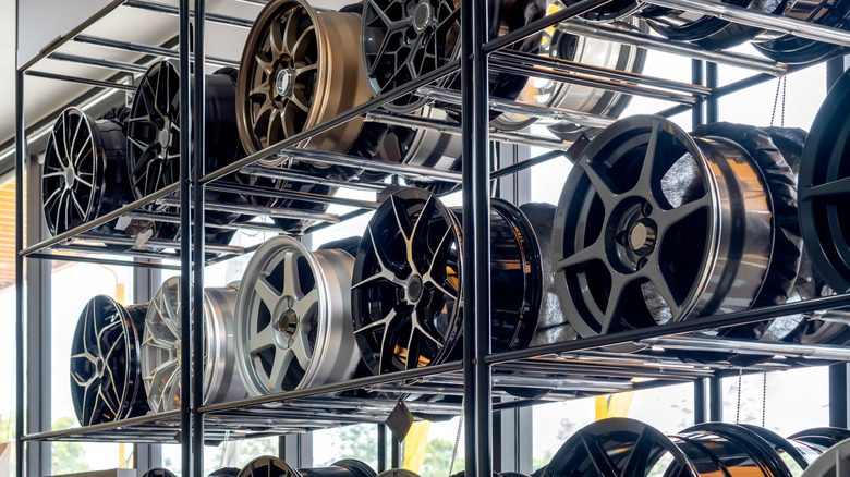 Tire rims stored on a metal shelf