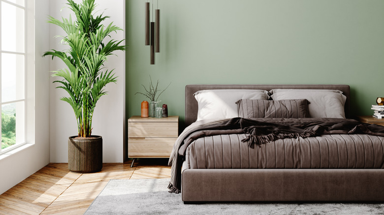 Modern bedroom with green wall