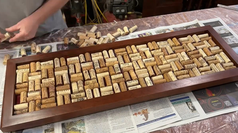 A DIY wine cork tray with corks arranged on their sides.
