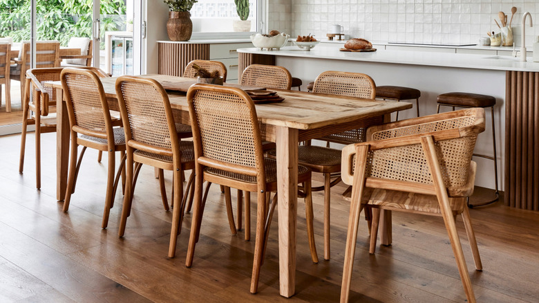 neutral dining room and kitchen with wicker decor