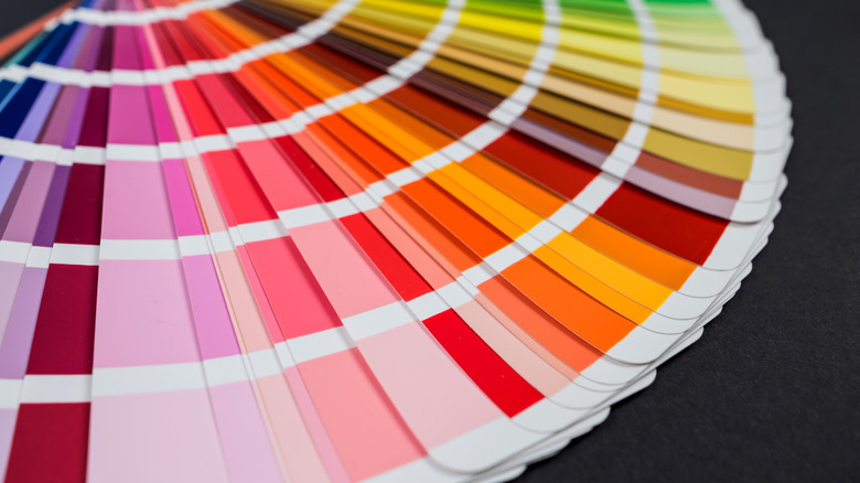 Bright color palette cards laid out on a black background