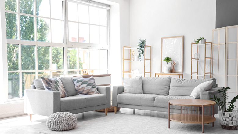 Gray and white room with floor to ceiling window