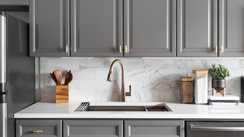 Kitchen sink with gray cabinets