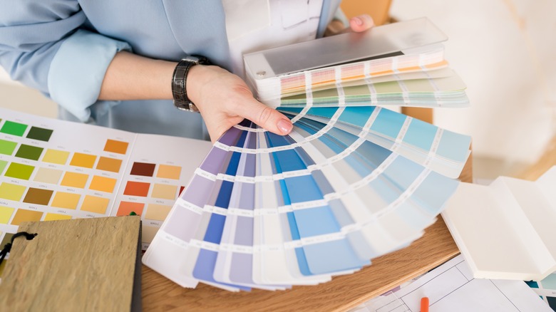 woman choosing paint colors