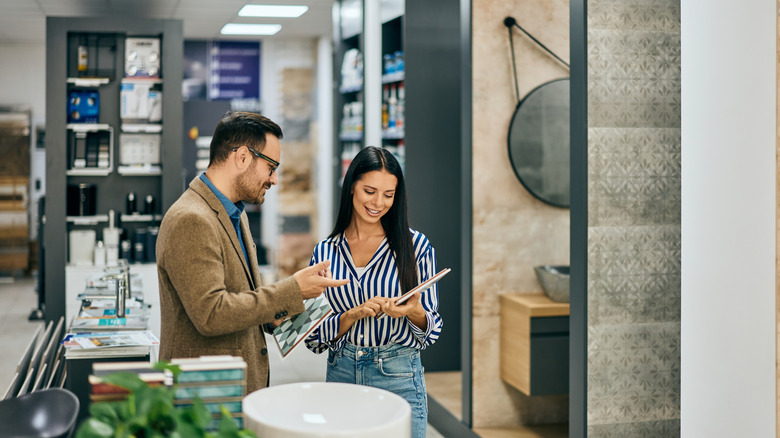 couple looking at tiles in a store
