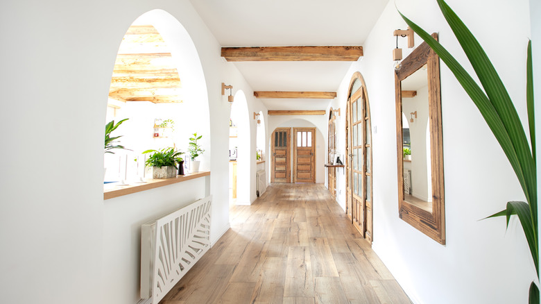 White hallway with wood accents