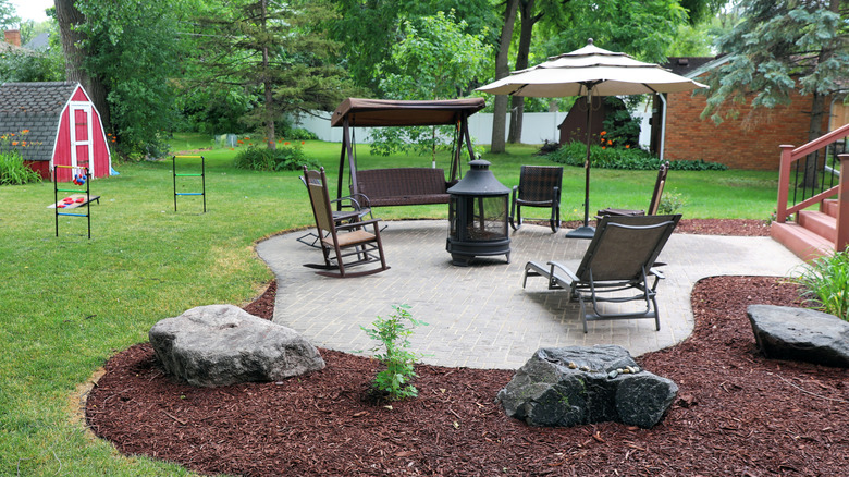 suburban backyard firepit visible