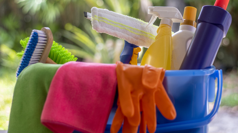 Bucket of cleaning supplies outside