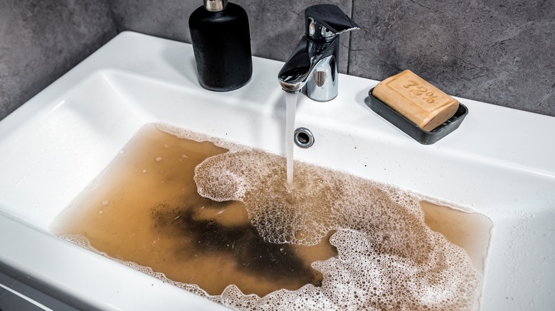 A clogged bathroom sink