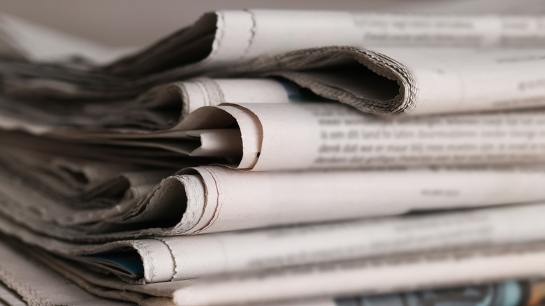 A close-up view of several rolled-up newspapers
