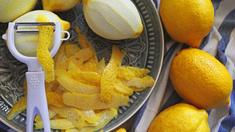 lemons and lemon peels on a dish