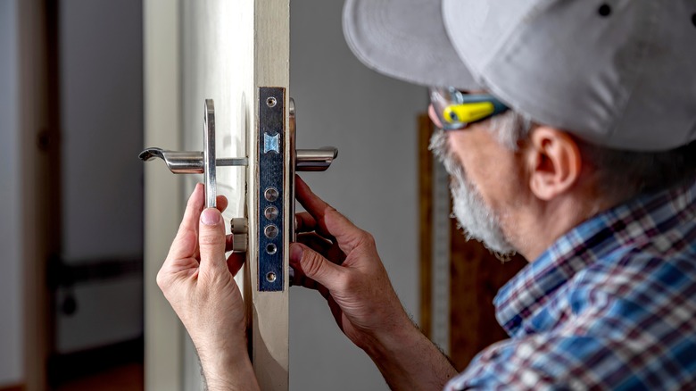 Man fixing door