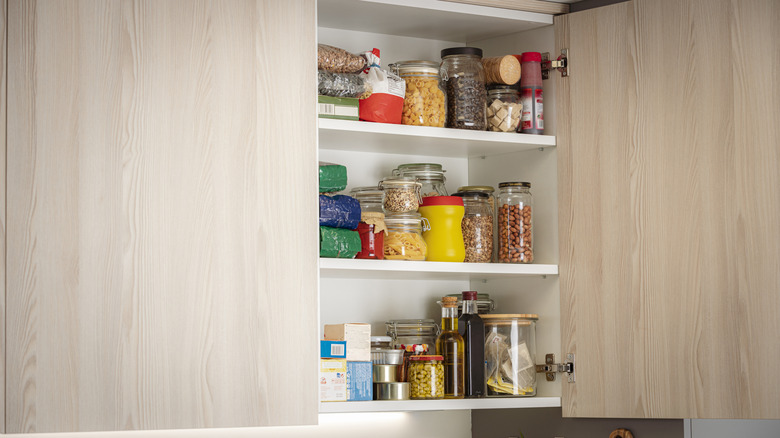 A cabinet full of pantry items