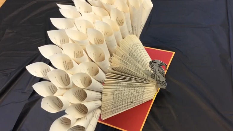 A book turned into a turkey decor piece