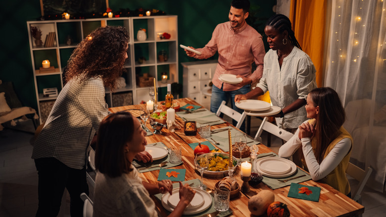 Friends setting their table for Thanksgiving