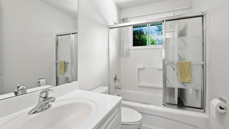 bathroom with open window in shower