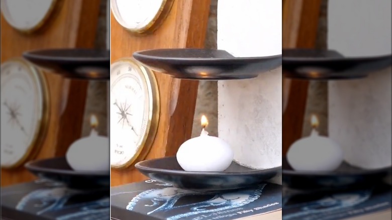 A candle holder made of stone dishes and concrete