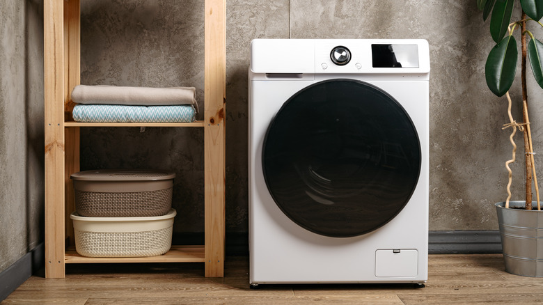 White washer/dryer combo unit in a laundry room
