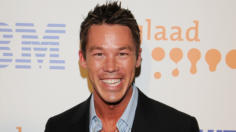 David Bromstad smiles on a carpet event