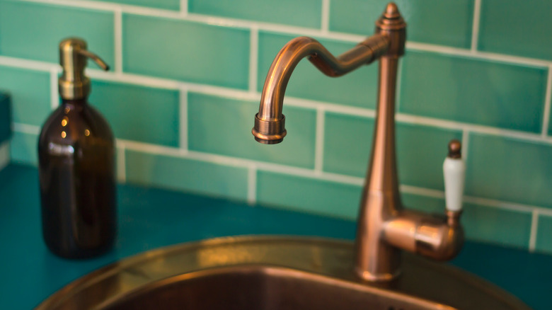 copper faucet and sink