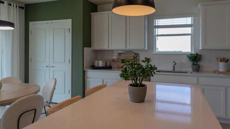 Kitchen with white Corian countertops