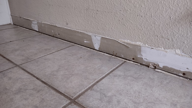removing baseboard for tile
