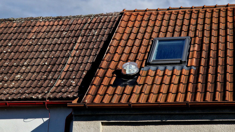 tiled roof with skylight and domed sun tunnel installed