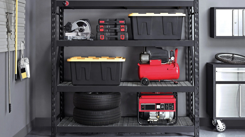 The Gorilla Rack Industrial Shelving with garage equipment and tires on the shelves