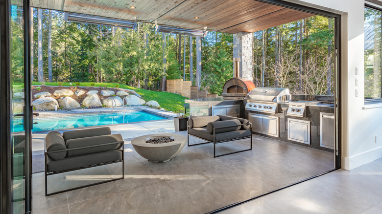 a large backyard patio and an outdoor kitchen area