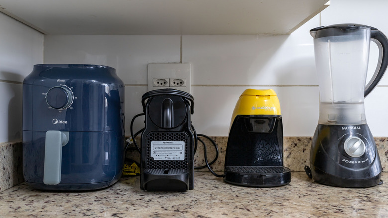 small kitchen appliances sitting on a countertop