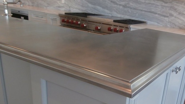 Close-up of a shiny gray countertop with an ogee edge