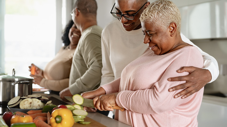 family cooking together in a kitchen