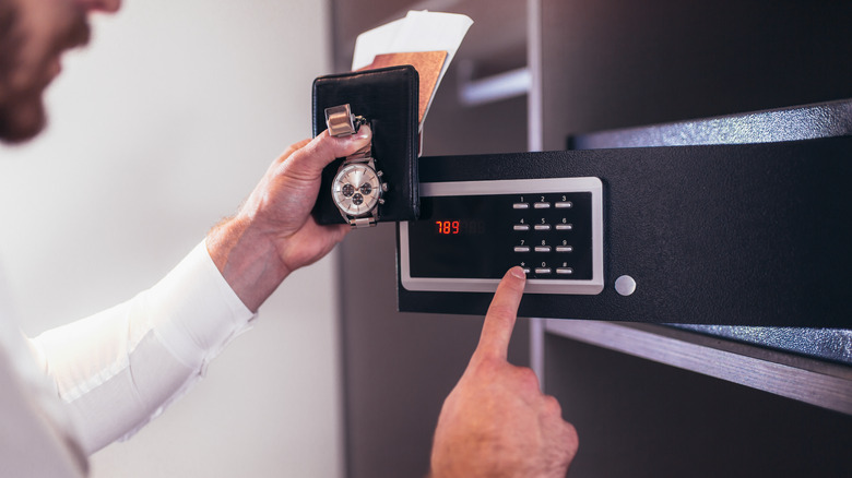 Man accessing documents in safe