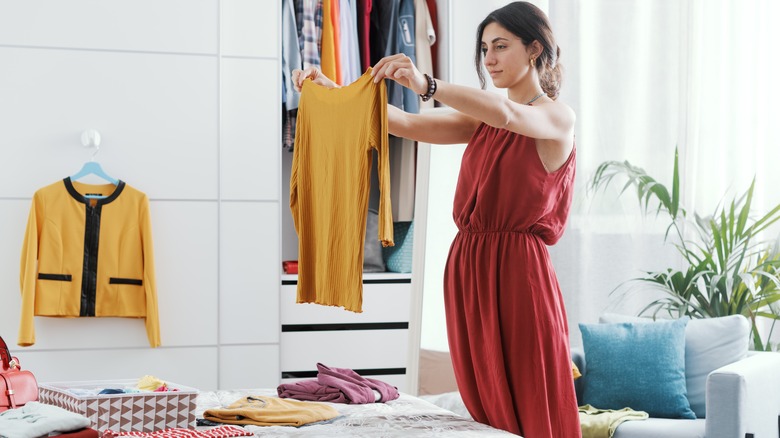 Someone organizing their clothes