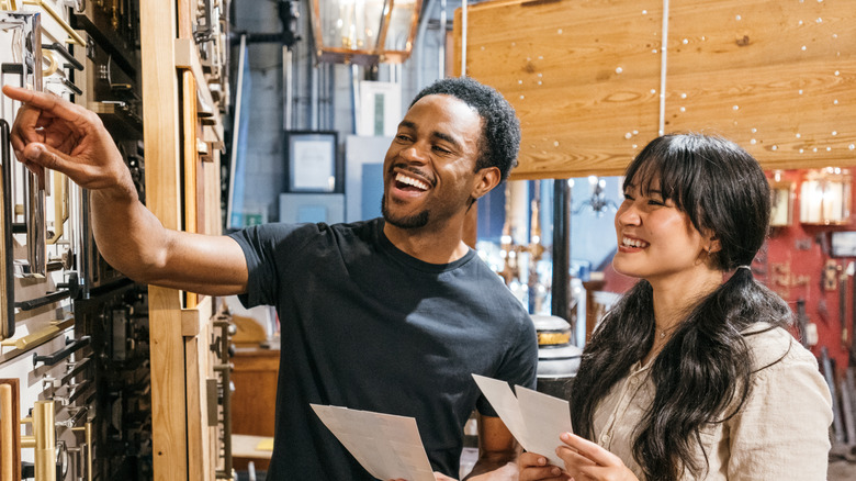 Man and woman browsing wares at secondhand store