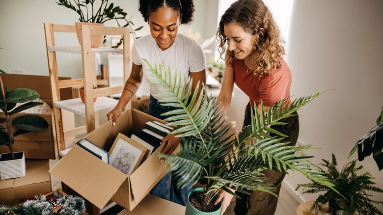 Women moving in boxes