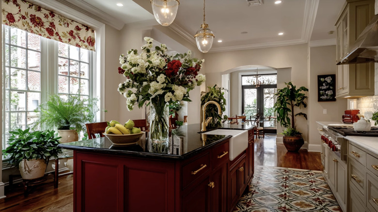 Elegant contemporary kitchen with a burgundy red island