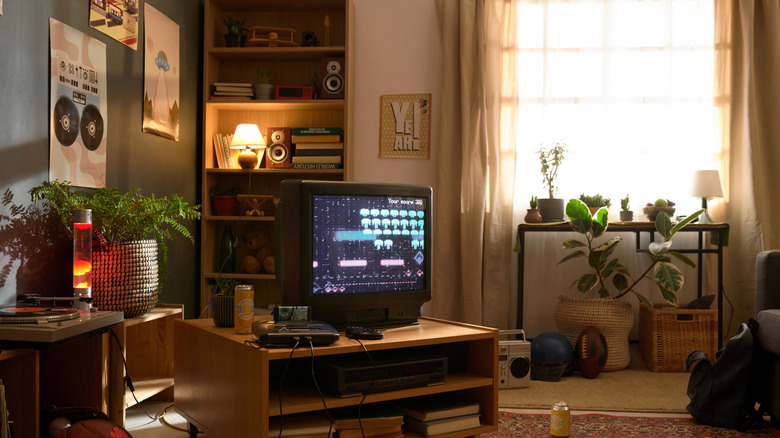 A 1990s living room full of furniture and appliances from the era.