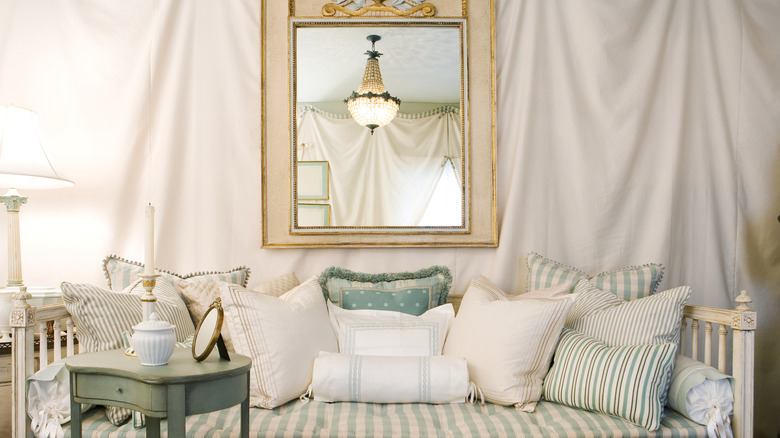 Living room with gingham couch and decorator pillows.