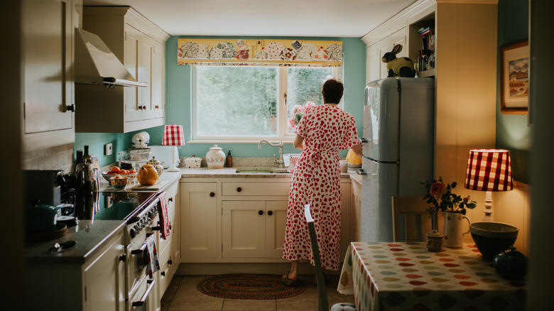 Whimsical cottage-core kitchen with colorful walls and woodland accents