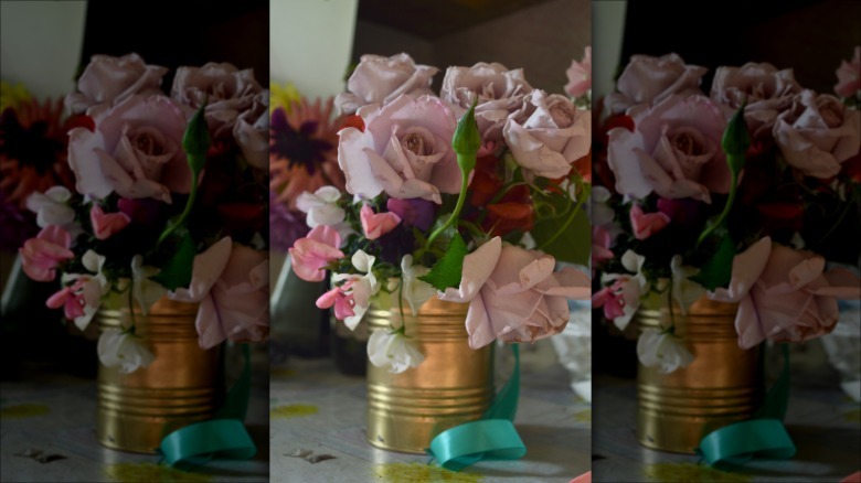 Flowers in old coffee can
