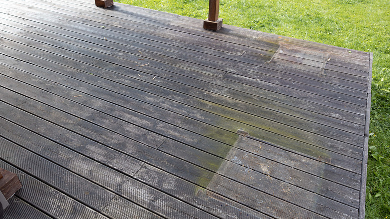Worn and discolored wood decking that needs to be replaced
