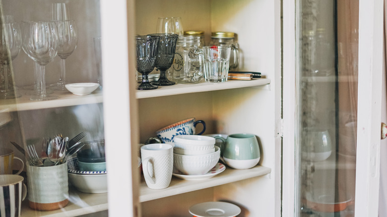 dishes sitting on shelf