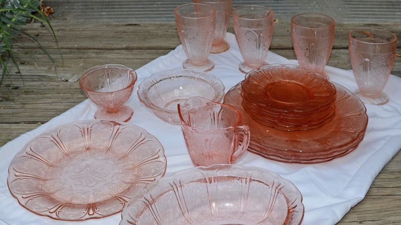 Pink depression era elegant glass dish set on white cloth