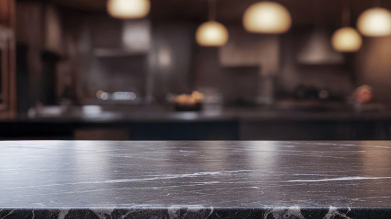 Closeup of a black marble kitchen counter