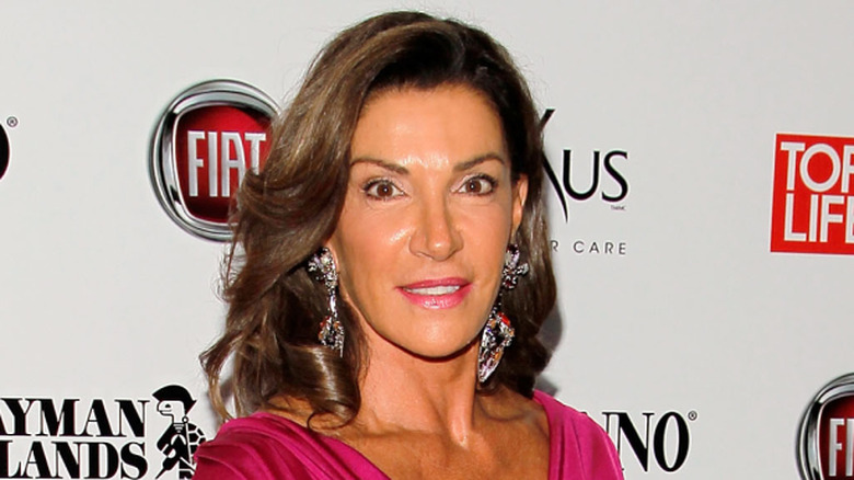 Hilary Farr smiling at event in hot pink dress