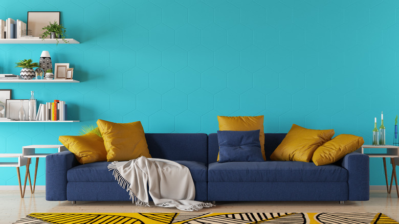 Bright teal living area wall