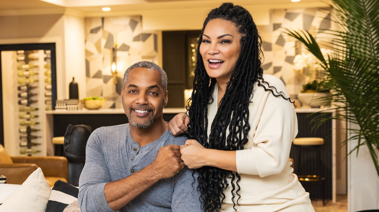 Egypt Sherrod and Mike Jackson laughing and fist-bumping
